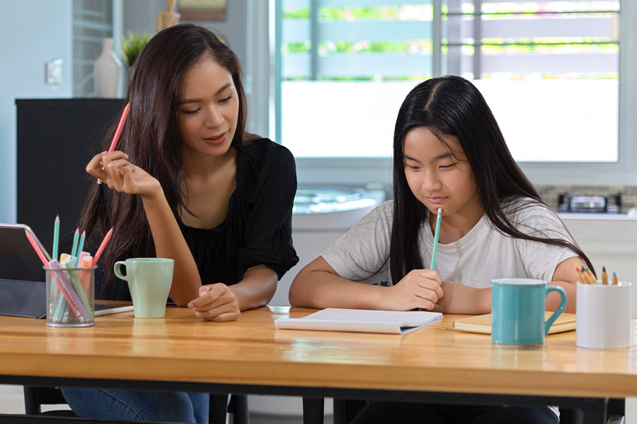 student and tutor together at a desk in Fresno